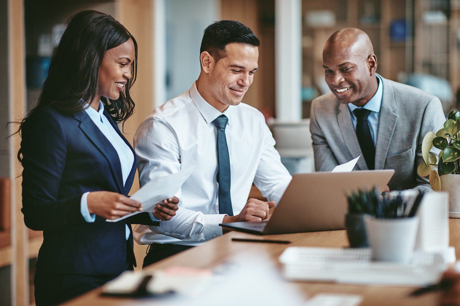 Diverse group of smiling businesspeople working in an office 3 On-Site Interpreters
